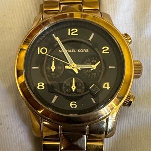 Men’s heavy duty MK watch.